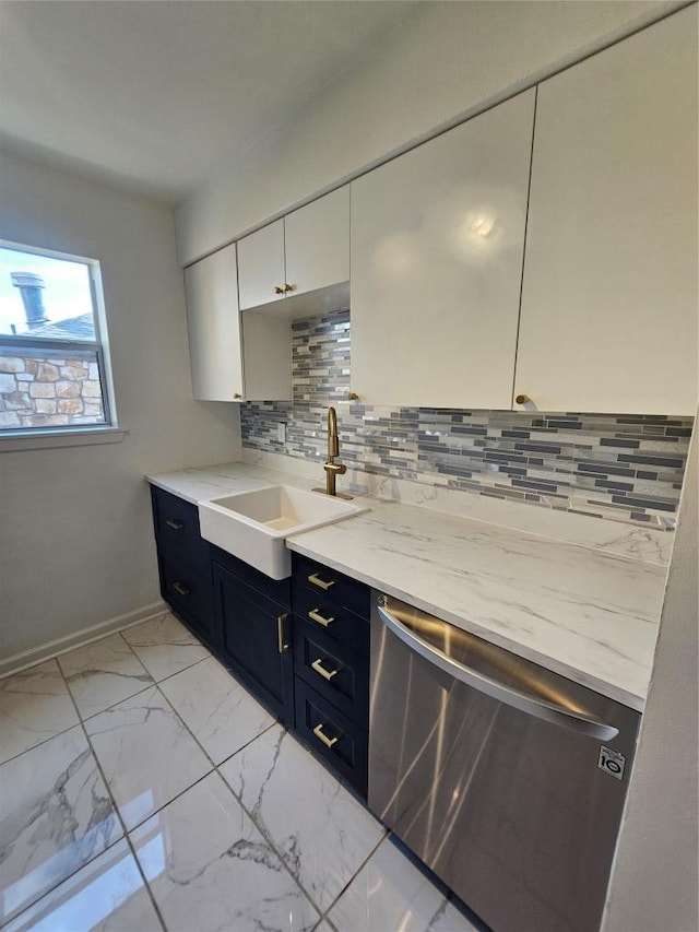 6903 Deatonhill Dr Unit 2, Austin, TX 78745 - kitchen with stainless steel dishwasher, backsplash, light marble finish floors, light stone counters, and white cabinets