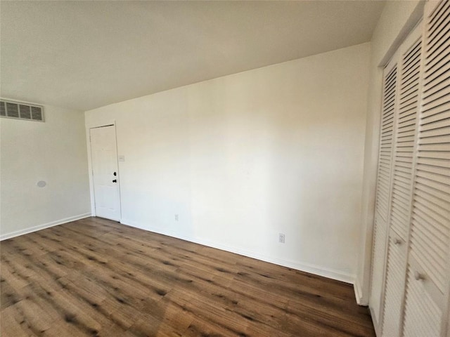 6903 Deatonhill Dr Unit 2, Austin, TX 78745 - unfurnished bedroom featuring dark wood-style flooring and a closet