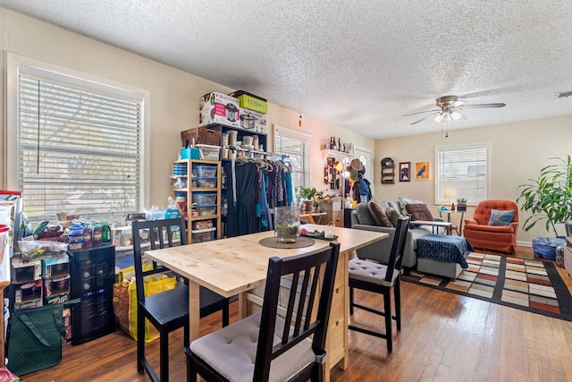 1513 Ruth Ave, Austin, TX 78757 - dining space featuring hardwood / wood-style floors, visible vents, a textured ceiling, and ceiling fan