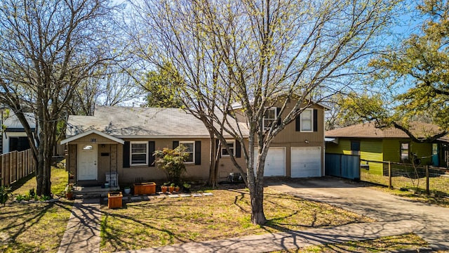 1513 Ruth Ave, Austin, TX 78757 - split level home featuring brick siding, driveway, an attached garage, and fence
