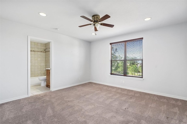 149 Colovista Dr, Bastrop, TX 78602 - unfurnished bedroom with light colored carpet, recessed lighting, ensuite bathroom, and ceiling fan