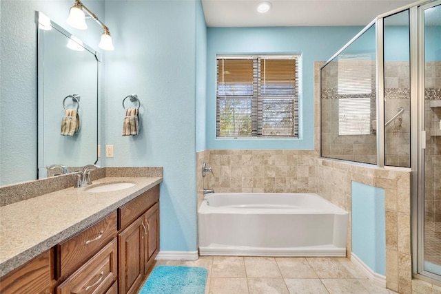 149 Colovista Dr, Bastrop, TX 78602 - bathroom featuring a bath, vanity, a shower stall, and tile patterned flooring