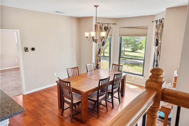 149 Colovista Dr, Bastrop, TX 78602 - dining room with a chandelier and wood finished floors