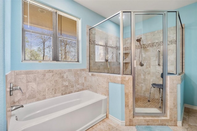 149 Colovista Dr, Bastrop, TX 78602 - full bath with a bath, a shower stall, plenty of natural light, and tile patterned floors