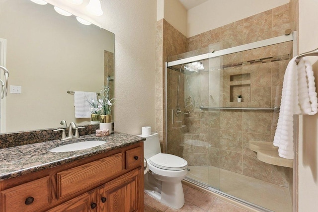 2812 Prosperity, Leander, TX 78641 - full bathroom featuring vanity, a shower stall, toilet, and tile patterned flooring
