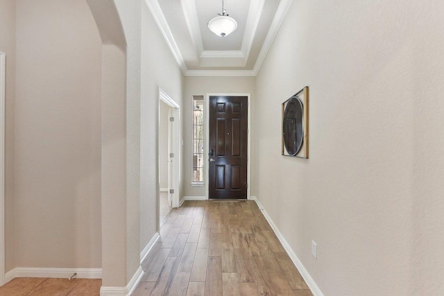 2812 Prosperity, Leander, TX 78641 - foyer featuring arched walkways, light wood finished floors, baseboards, and crown molding