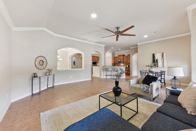 2812 Prosperity, Leander, TX 78641 - living area with ceiling fan, arched walkways, light tile patterned floors, baseboards, and crown molding