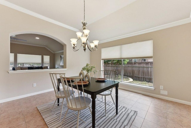 2812 Prosperity, Leander, TX 78641 - dining space with tile patterned flooring, a chandelier, arched walkways, ornamental molding, and baseboards