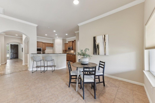 2812 Prosperity, Leander, TX 78641 - dining area with arched walkways, light tile patterned flooring, recessed lighting, crown molding, and baseboards