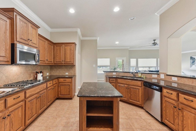 2812 Prosperity, Leander, TX 78641 - kitchen with appliances with stainless steel finishes, a sink, open shelves, ceiling fan, and brown cabinetry