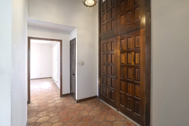 foyer entrance with baseboards