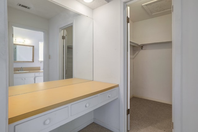 bathroom with visible vents, vanity, and baseboards