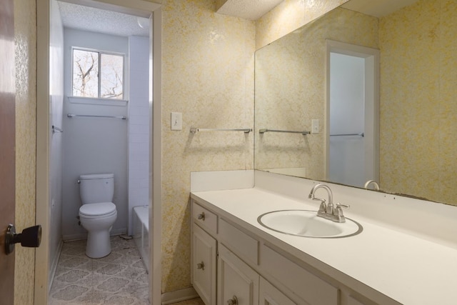 full bath with toilet, a bath, vanity, and wallpapered walls