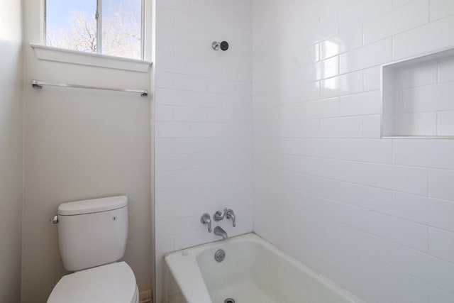 bathroom with shower / bath combination and toilet