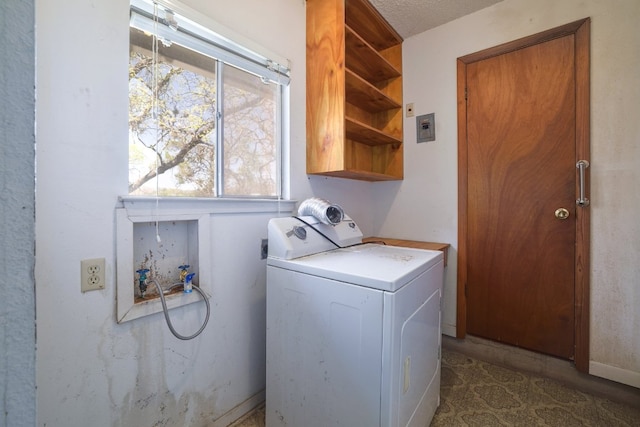 washroom featuring cabinet space and washer / clothes dryer