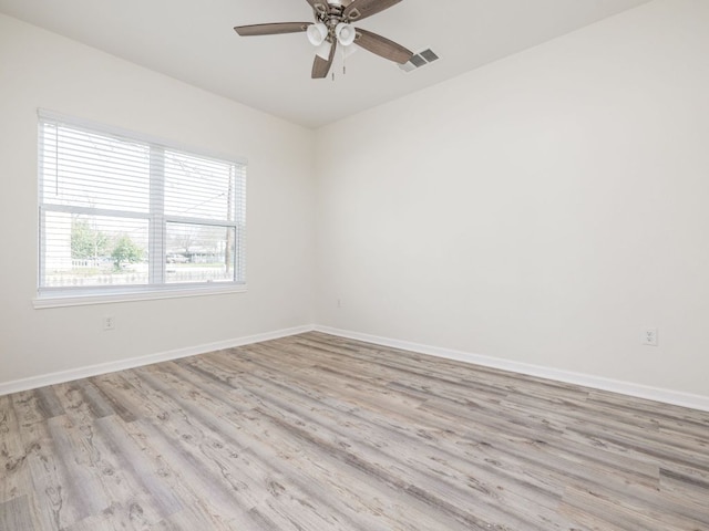 1401 W 7th St, Taylor, TX 76574 - unfurnished room featuring light wood finished floors and a ceiling fan