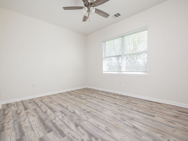 1401 W 7th St, Taylor, TX 76574 - spare room featuring light wood finished floors and a ceiling fan