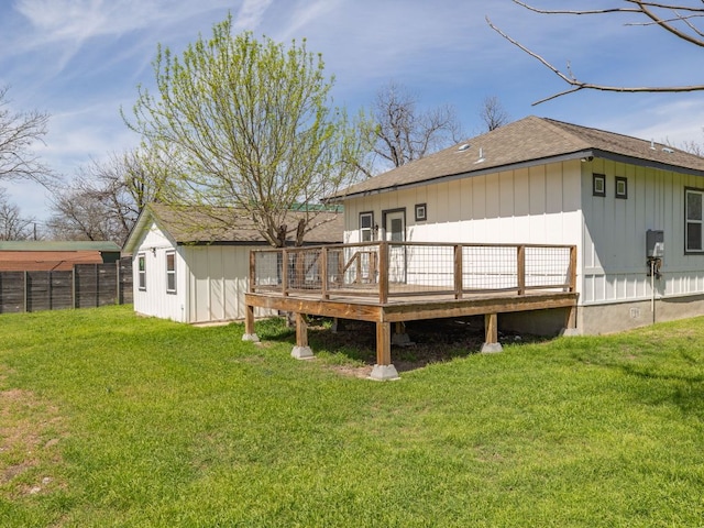 1401 W 7th St, Taylor, TX 76574 - rear view of property with a wooden deck, a shingled roof, and board and batten siding