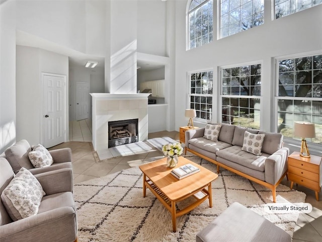 2119 Simbrah Dr, Cedar Park, TX 78613 - tiled living area featuring a high ceiling, built in features, and a tiled fireplace