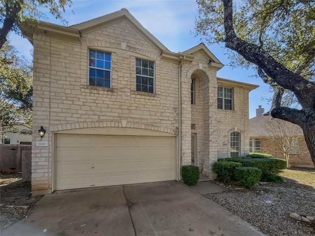 2119 Simbrah Dr, Cedar Park, TX 78613 - traditional-style home with an attached garage, concrete driveway, and stone siding