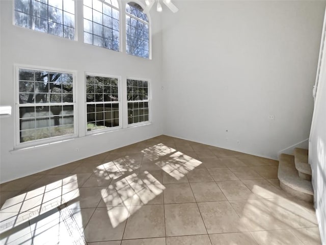 2119 Simbrah Dr, Cedar Park, TX 78613 - unfurnished dining area with tile patterned floors, plenty of natural light, a towering ceiling, and ceiling fan