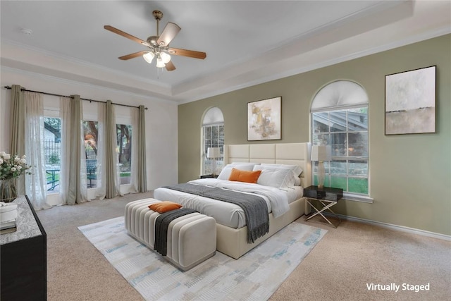 201 Lasso, Horseshoe Bay, TX 78657 - carpeted bedroom with a raised ceiling, multiple windows, crown molding, and a ceiling fan