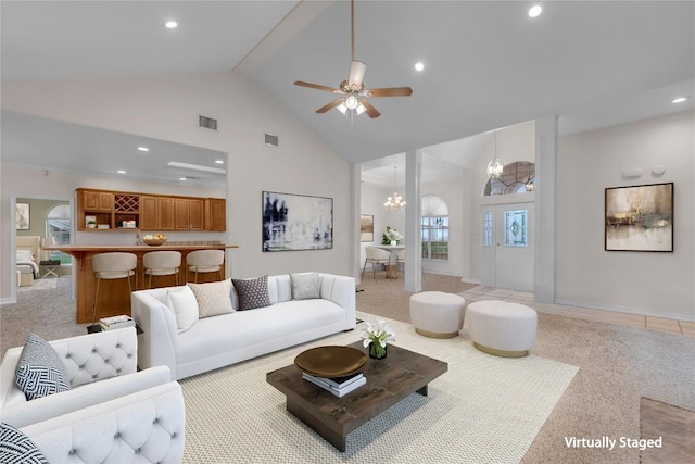 201 Lasso, Horseshoe Bay, TX 78657 - living room with high vaulted ceiling, light colored carpet, recessed lighting, a ceiling fan, and a chandelier