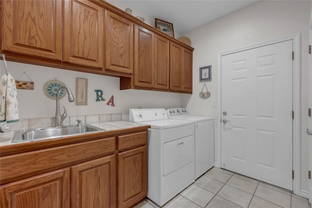 201 Lasso, Horseshoe Bay, TX 78657 - laundry room with cabinet space, washing machine and dryer, and light tile patterned flooring