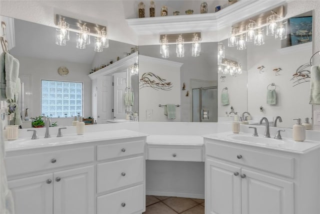 201 Lasso, Horseshoe Bay, TX 78657 - full bathroom with double vanity, a stall shower, tile patterned floors, vaulted ceiling, and a chandelier