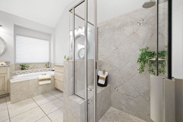 14320 Senia Bnd, Austin, TX 78738 - bathroom featuring vaulted ceiling, a garden tub, a shower stall, and vanity