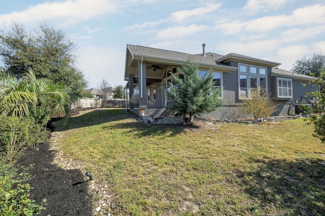 14320 Senia Bnd, Austin, TX 78738 - exterior space featuring fence, ceiling fan, and a yard