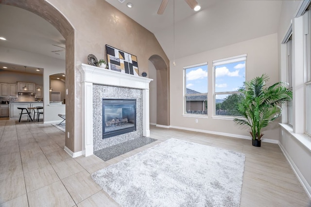 14320 Senia Bnd, Austin, TX 78738 - living room with recessed lighting, ceiling fan, vaulted ceiling, and a fireplace