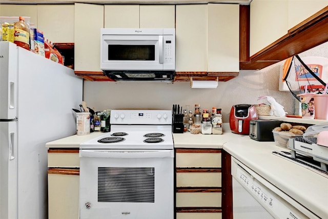 kitchen with white appliances and light countertops