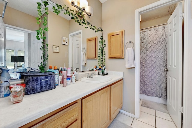 bathroom with vanity, tile patterned floors, and curtained shower