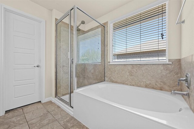 9209 Sweetgum Dr Unit 153, Austin, TX 78748 - full bathroom with healthy amount of natural light, a shower stall, and a bath