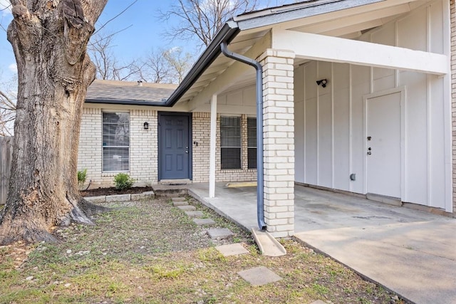 6705 Skynook Dr, Austin, TX 78745 - doorway to property with brick siding, roof with shingles, and concrete driveway