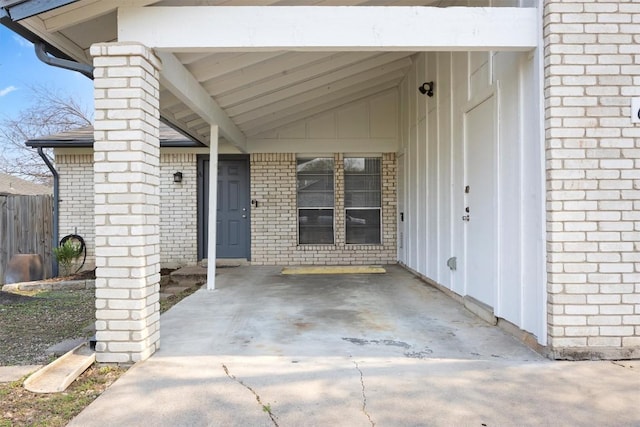 6705 Skynook Dr, Austin, TX 78745 - property entrance with brick siding and an attached carport