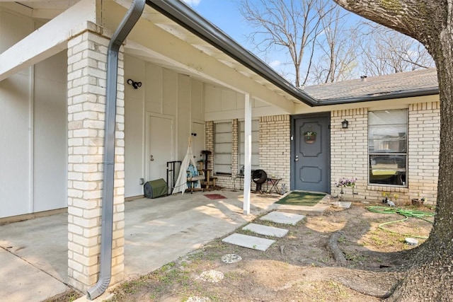 6705 Skynook Dr, Austin, TX 78745 - property entrance featuring brick siding and a shingled roof