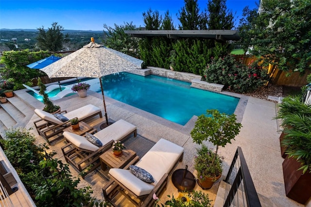 view of pool with an outdoor living space, a fenced in pool, a patio, and a fenced backyard