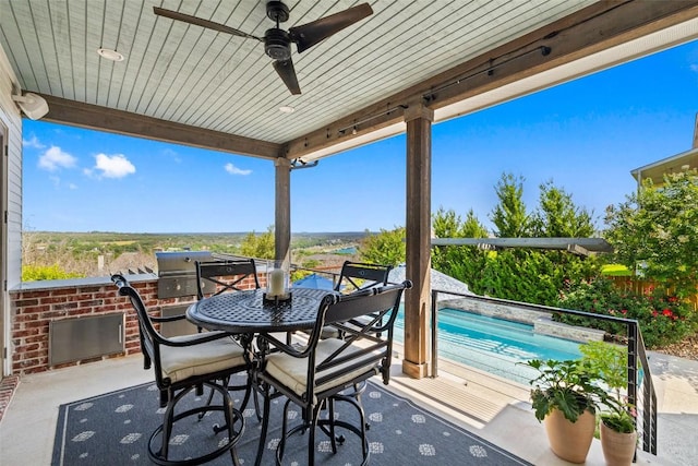 view of patio with outdoor dining space, a fenced in pool, a ceiling fan, and fence