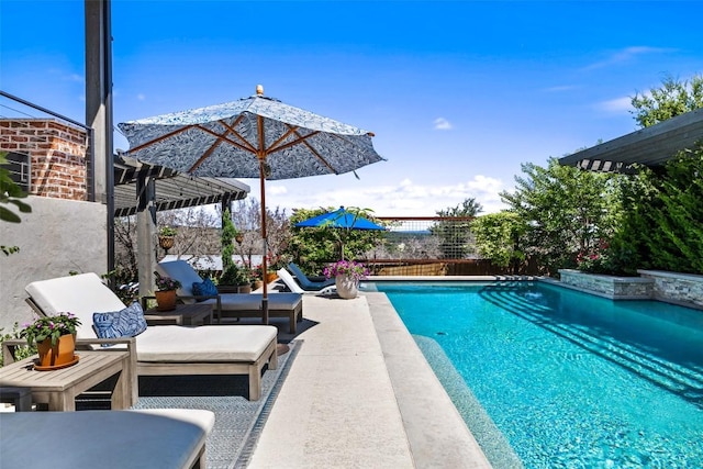 view of swimming pool featuring a fenced in pool, outdoor lounge area, a patio, and fence