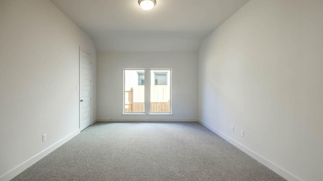 163 Plumbago Loop, Bastrop, TX 78602 - unfurnished room with light colored carpet and baseboards