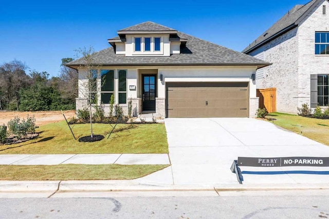 163 Plumbago Loop, Bastrop, TX 78602 - view of front of house featuring an attached garage, a shingled roof, driveway, and stucco siding