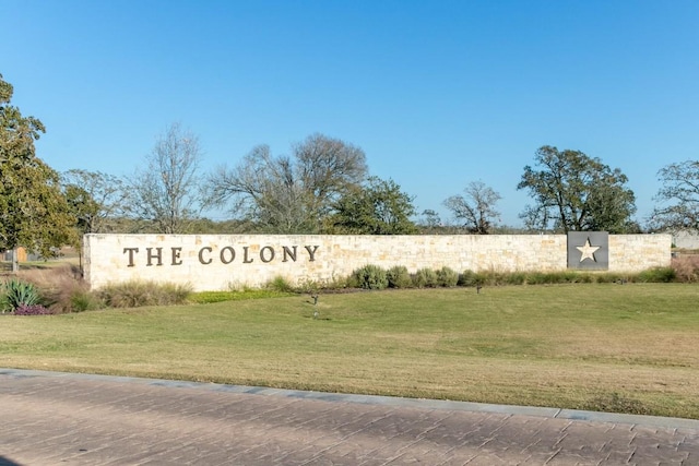 163 Plumbago Loop, Bastrop, TX 78602 - community sign with a yard