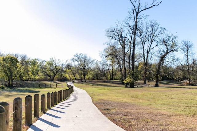 163 Plumbago Loop, Bastrop, TX 78602 - surrounding community with a yard