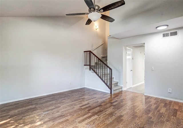 901 E Village Ln, Austin, TX 78758 - unfurnished living room with wood finished floors, stairs, a ceiling fan, and baseboards