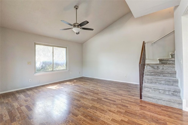 901 E Village Ln, Austin, TX 78758 - unfurnished room with vaulted ceiling, stairway, ceiling fan, wood finished floors, and baseboards