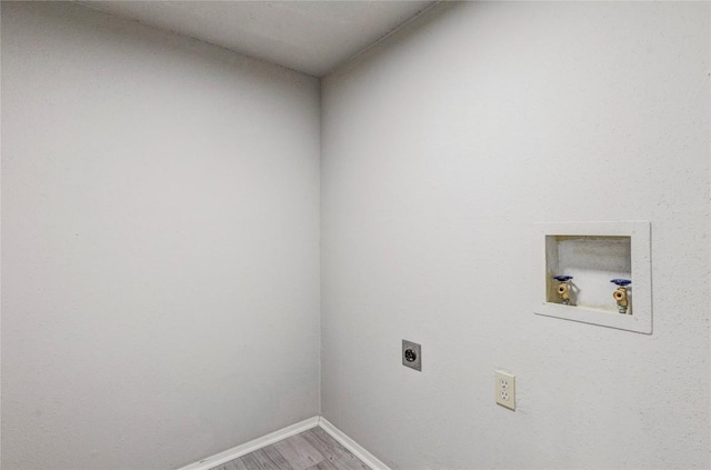 901 E Village Ln, Austin, TX 78758 - washroom featuring hookup for an electric dryer, washer hookup, and wood finished floors