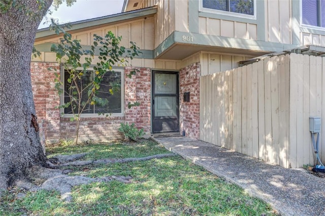 901 E Village Ln, Austin, TX 78758 - property entrance with brick siding and board and batten siding