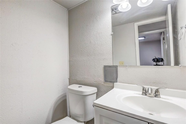 901 E Village Ln, Austin, TX 78758 - half bathroom featuring a textured wall and vanity